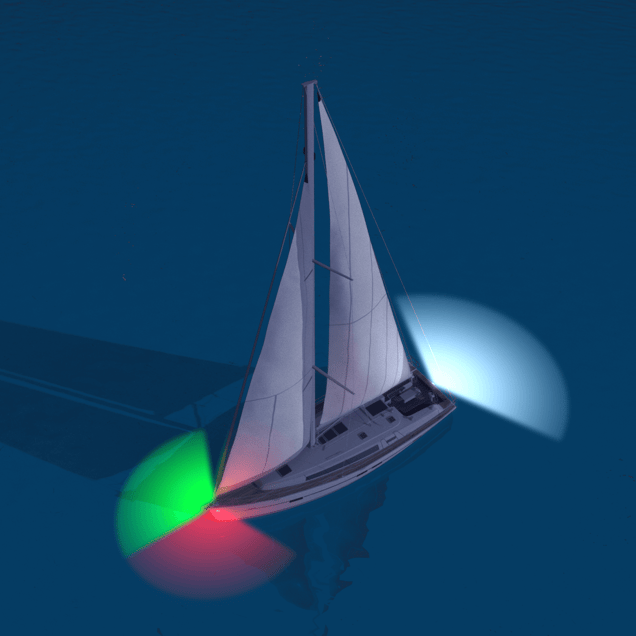 image of a properly lit sailboat at night